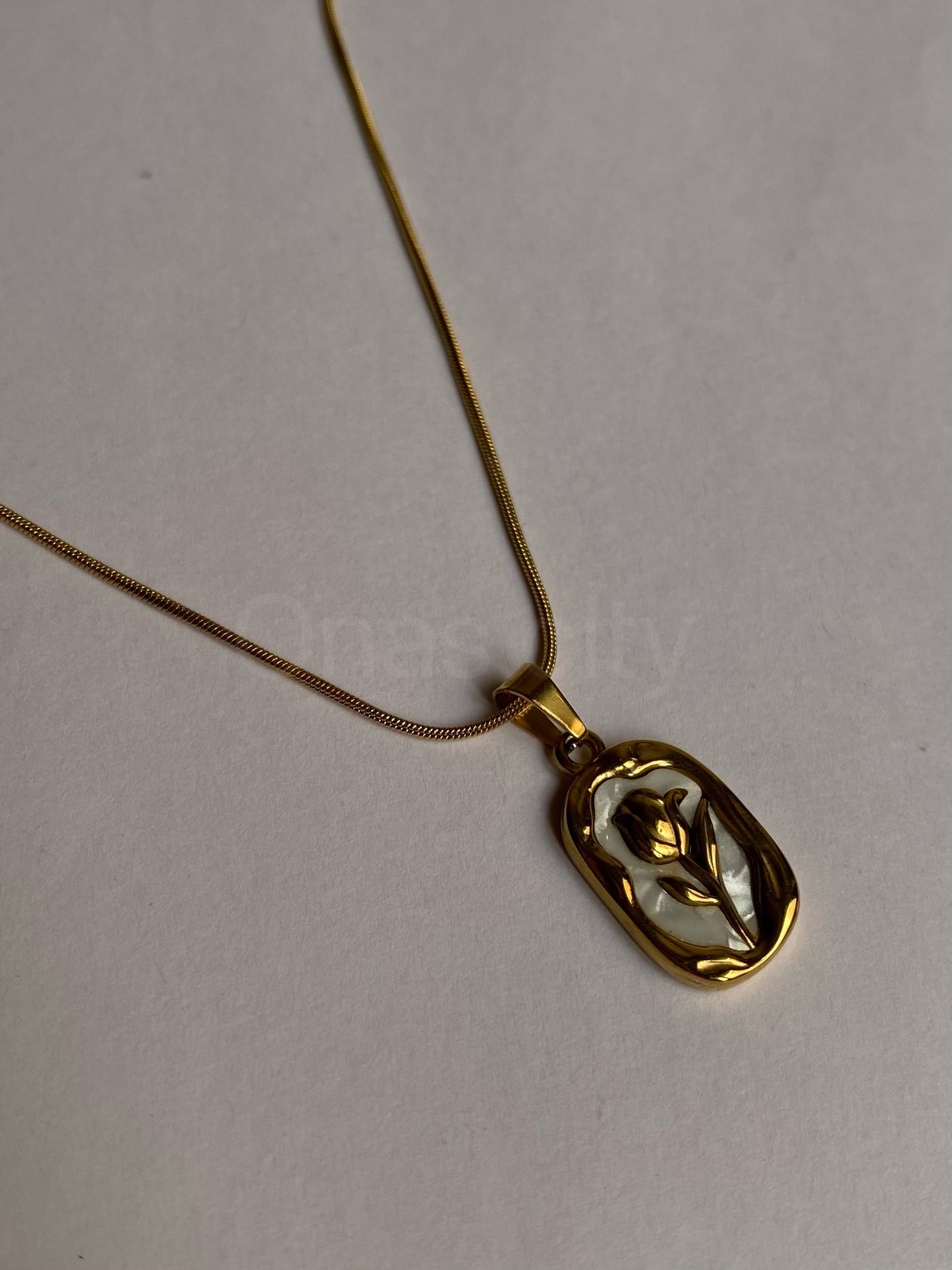 Gold rose with white background necklace